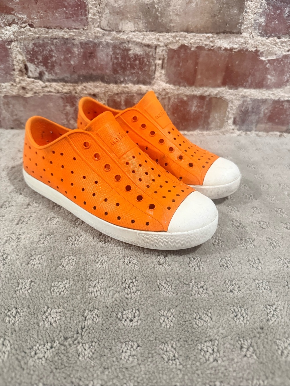 Native Jefferson Slip-On Kids Sneakers in Bright Orange with White Toe